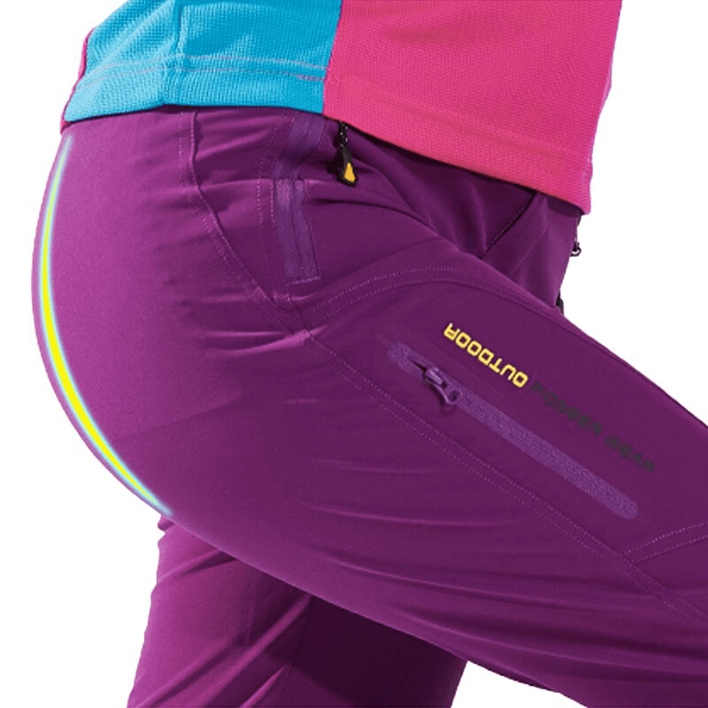 Close-up of purple waterproof quick dry women's pants with pockets, ideal for outdoor activities like trekking and cycling.